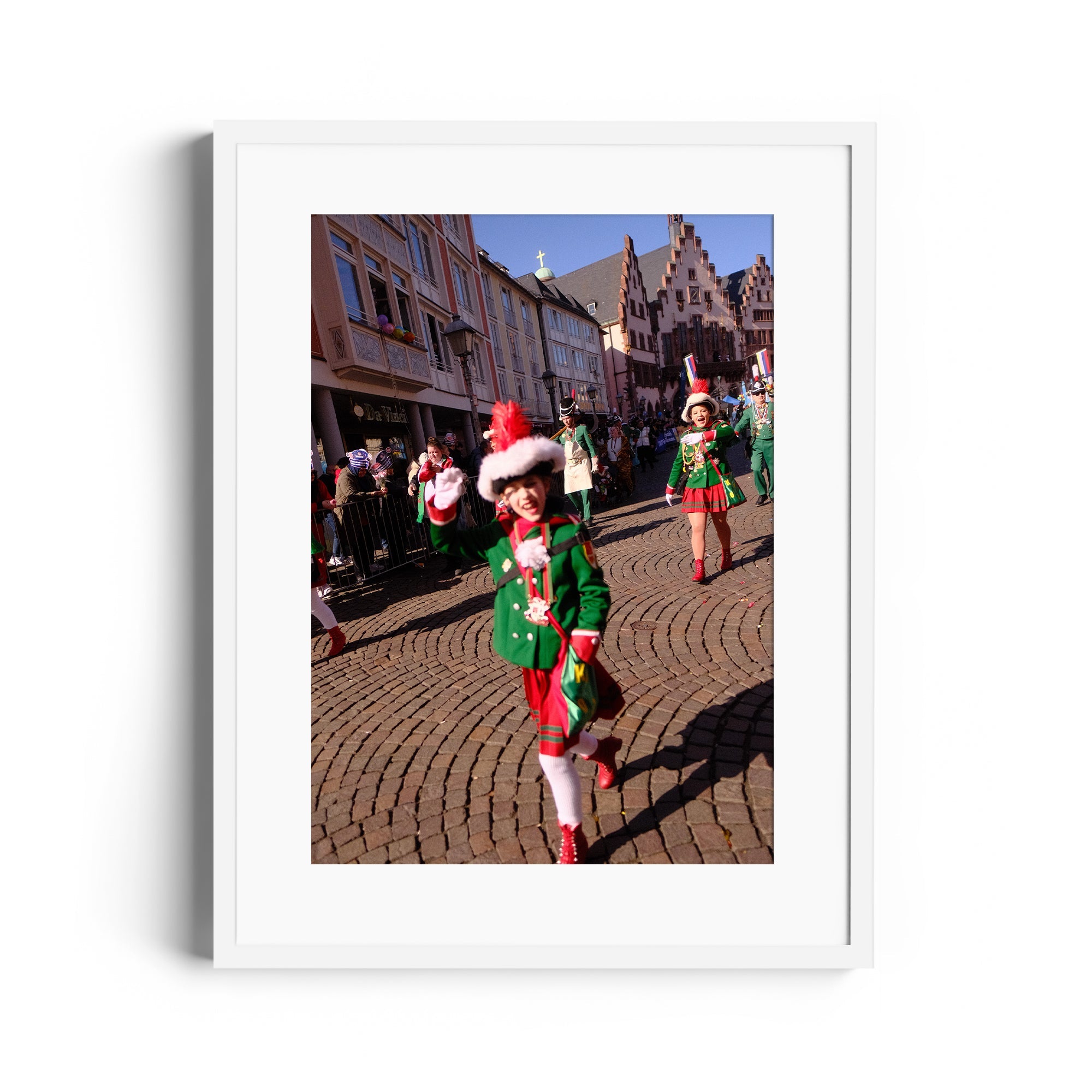 Parade participant in festive green outfit waving, captured in fine art photography from The Dana Gallery, Miami, Florida.