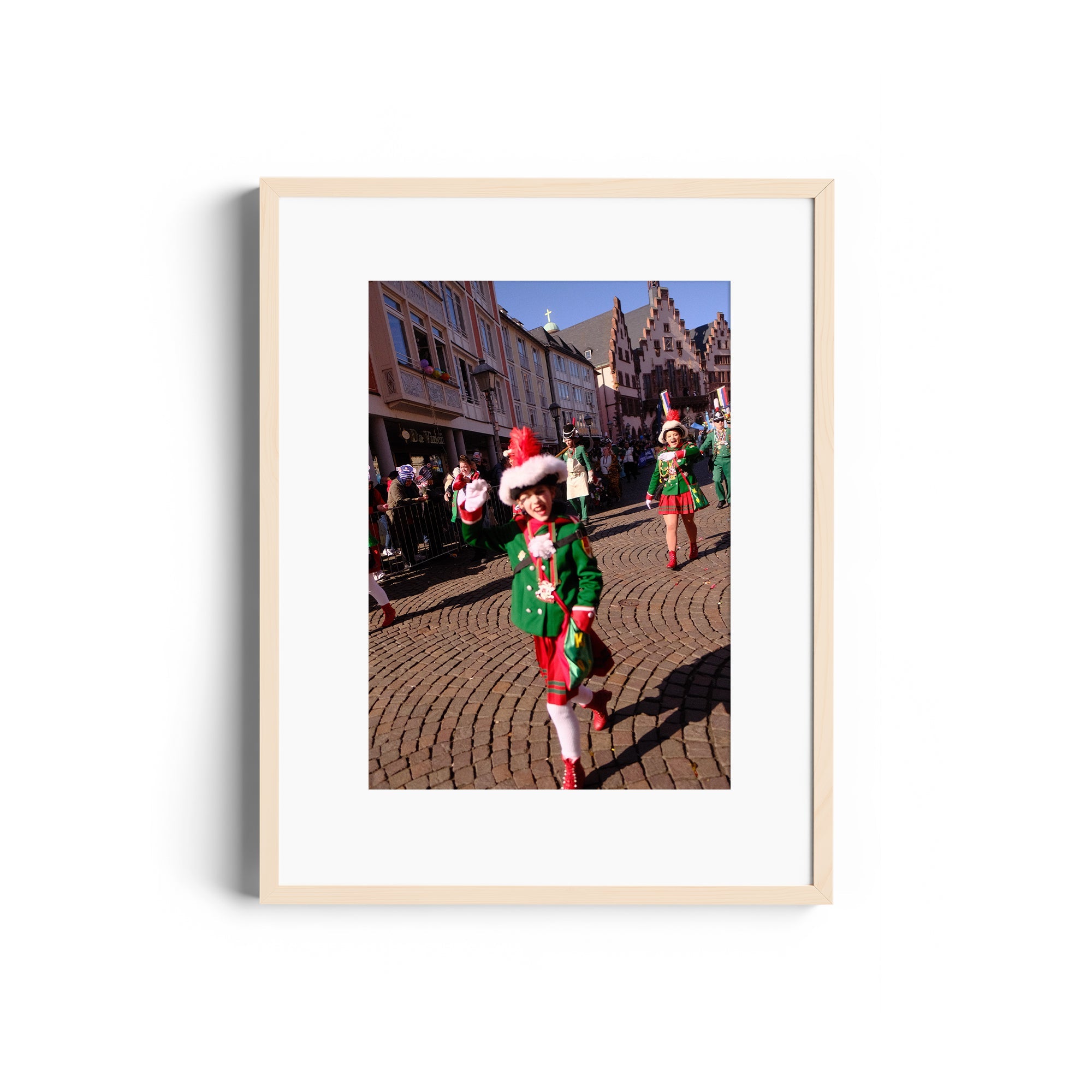 Framed fine art photo of a festive parade participant in colorful attire, displayed at The Dana Gallery, Miami, Florida.